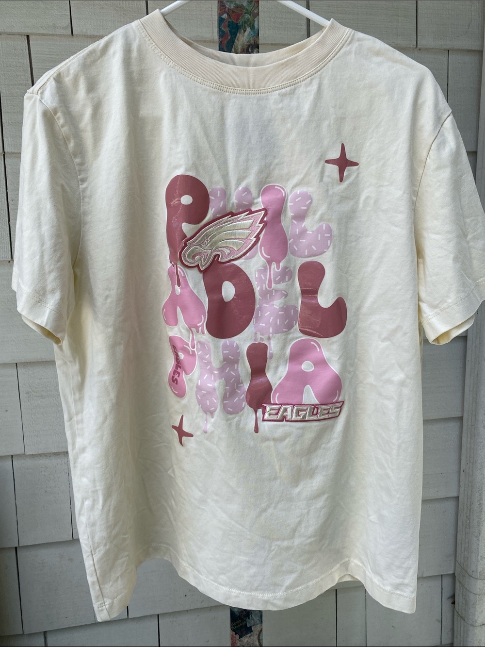 Philadelphia Eagles Cream Short Sleeve Graphic Tee with Pink Eagles Design